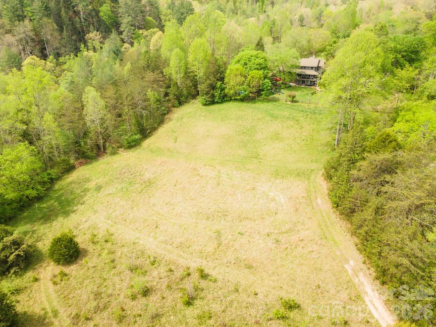 Discover the perfect canvas for your dream mountain retreat or investment project. This expansive, wooded property offers rare privacy and tranquility just minutes from the crystal-clear waters of Lake James.
Ready-to-Build Canvas: Unlock the potential of this remarkable 52 acre tract of unimproved land, offering a rare combination of significant acreage and a prime location near the foothills of the Blue Ridge Mountains. This property is an exceptional find for those seeking a private estate, a residential development project, or a long-term investment in one of North Carolina’s most sought-after recreational areas.
At approximately 52.3 acres, this property offers unparalleled privacy and space for horses, agricultural pursuits, or a private trail network. Situated just minutes from the pristine waters of Lake James, you are perfectly positioned to enjoy world-class boating, fishing, mountain biking and hiking at Lake James State Park, Fonta Flora Trail, Linville Boat Ramp, Lake James Marina and many other close lake access areas. Since 0 Henderson Mill Rd is zoned for Mixed-Use, you aren't just buying a piece of land; you’re buying a "blank slate" for a live-work-play destination. This rare zoning near Lake James allows you to combine residential, commercial, and even light industrial uses on a single tract.