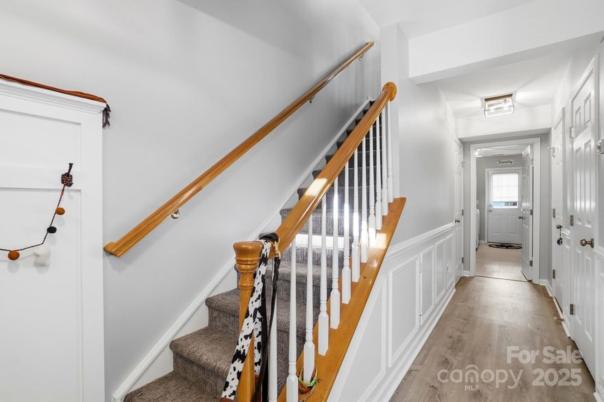 Motivated Seller offering $2500 credit towards closing costs/rate buy down. Welcome to 11528 Destin Lane, a beautifully updated 3-bedroom, 2 full bath, 2 half bath townhome in the desirable Stillwater community of Charlotte! This 3-story home offers nearly 2,000 square feet of stylish living space, blending comfort, function, and modern design in one perfect package.

The main level showcases an inviting open-concept layout with a spacious living area with access to the deck with privacy fencing, cozy fireplace, and a dining room featuring a gorgeous shiplap accent wall which is a true showpiece that adds warmth and character. The updated kitchen includes stainless steel appliances, a gas range, and plenty of cabinet space, making it both beautiful and practical.

Upstairs, you’ll find two bedrooms, including a spacious primary suite with an exposed real brick accent wall, giving the space unique texture and charm. The ensuite bath offers dual sinks and a relaxing feel, perfect for unwinding at the end of the day.

The lower level features a flexible space which can be used as a 3rd bedroom / office, laundry area, the laundry room, and additional half bath, ideal for working from home or hosting guests. Step outside and enjoy access to community walking trails, an outdoor pool, and a serene neighborhood setting close to Ballantyne, shopping, dining, and entertainment.

With a one-car attached garage, gas heat, and a location that balances convenience with quiet, this home is ready to impress. Come experience the charm and functionality that make 11528 Destin Lane a standout in South Charlotte!