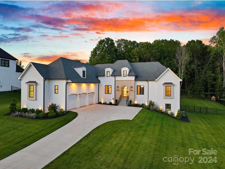 Experience unparalleled luxury in this custom-built, European-inspired masterpiece, offering over 5,900 square feet of living space, perfect for the avid entertainer. Featuring four spacious bedrooms and five full baths, with the primary suite conveniently located on the main level, this home is a showcase of designer elegance. Beyond the well-appointed bedrooms and bathrooms, the home includes a media room, fitness room, and home office, ensuring comfort and flexibility for all your lifestyle needs. This exclusive retreat offers the ultimate in luxury living, from the gourmet kitchen equipped with high-end Jenn-Air appliances to the expansive outdoor living area, lush backyard, and gleaming swimming pool. Every detail in this exquisite home has been meticulously crafted. Enjoy the convenience of Mooresville being minutes to stores, restaurants, and entertainment, making this home both a sanctuary and a gateway to all the area has to offer.