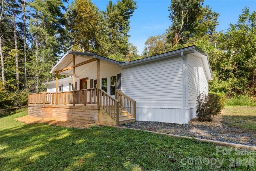 Brand new HVAC system installed in 2025! 

Home is refreshed with “attention to details,” and has a cabin like feel for the perfect mountain getaway.
Enjoy mountain and river views right outside your front door. Two private lots totaling a full acre of land with
a good mix of flat yard space and gently sloped land that would be ideal for livestock, terraced gardens or a
natural mountain landscape. This is a home that creates an opportunity for a slower, intentional lifestyle.
With a large front deck and a smaller back deck to enjoy a variety of outdoor living activities. Relaxing
dinners? Cozy nights watching fireflies and stargazing? There are endless opportunities here in this private
wooded spot. The home itself is a nod to a quiet, cozy mountain retreat. The knotty pine walls create a
warmth that only amplifies the wood-burning stove in the den and flows into a versatile room that can serve
as a separate dining room or space to gather for game nights and libations with friends. Imagine the
memories that can be made here! Conveniently located between Burnsville, NC and Spruce Pine, NC, yet
tucked away from the hustle and bustle. If you're looking for a natural playground, why not head down to
Mount Mitchell or the South Toe River only a short drive away? This home is an ideal second home or natural
mountain retreat that offers the ultimate balance of tranquility and convenience. Seller is working with vendor to install a private well, per seller they are on the schedule to have the work performed 3-5 weeks from listing date. Home is sold as-is, where is.