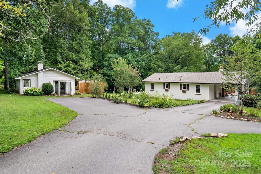 Turnkey investment opportunity in wonderfully burgeoning Black Mountain!! Nestled at the end of the road on almost two private acres, this beautiful Ranch home has been beautifully updated and includes three separate living quarters, each with their own access. This home has it all! Newer HVAC (2023), newer roof (2020), newer solar panels (2023), and a new septic tank will make this a worry-free place for years to come. The property has a large level yard, mature vegetation, just enough tree cover, and a small creek which runs the border. The large barn is in terrific condition and is already wired for electricity. The cottage has been operating as a successful short-term rental and the lower level as a long-term offering, each of which have their own parking and private entrances. There's a wide variety of options in how to utilize this home. Whether you are looking for rental income, a multi-family solution, or just an exquisite homestead, this property has something for everyone!