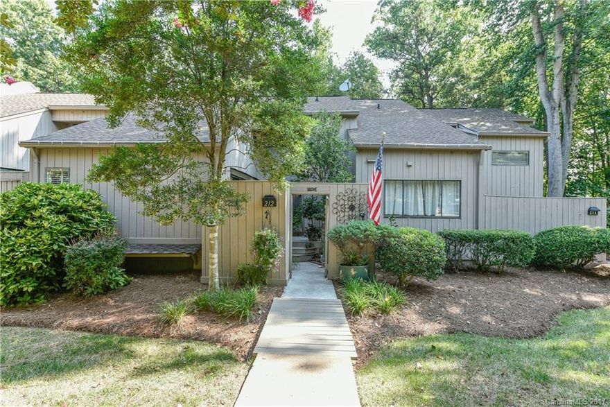 Fabulous 4 bedroom condo with updated kitchen & baths. MASTER ON MAIN. Lots of natural light. Open deck on main floor and screen porch on lower level overlook lake and marina. Nothing but trees between townhouse and lake. MOVE-IN READY!!!  New HVAC 2017; new hot water heater 2016; all new flooring and paint 2014. Bluff Villas is nestled within River Hills, a gated community with 24 hour guard. Walking trails, tennis and a park with a sandy beach. Great relaxing life style...This one won't last!