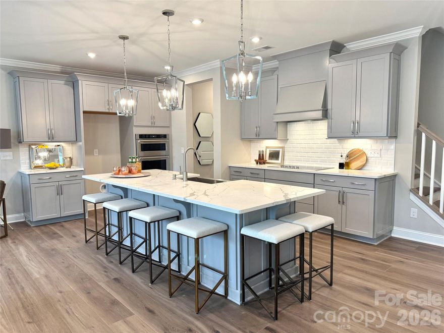 Location, Location, Location!  Luxury Brick 3 story townhome in Ballantyne features a 2nd floor Primary Suite with sitting area and 2 walk in closets!  Bedroom 4 is the 2nd Primary Suite on the 3rd floor and features a sitting area, walk in closet and en-suite bath with dual vanities.  The kitchen is appointed with Grey 42" cabinets with soft close drawers/doors with pull out trays.  Kitchen Aid appliances, ss Farmhouse sink, gorgeous white quartz and ceramic backsplash.  The home is filled with light from an abundance of LED recessed lights and beautiful trimmed windows.  Luxury wide vinyl plank flooring, 8' doors, crown molding, and 2" faux wood blinds throughout the home are a few of the upgrades that enhance this home.

One of 28 townhomes in our boutique community.  
Townes at Wade Ardrey is surrounded by residential communities while having retail and dining options close by.  1.5 miles from Blakeney Shopping Center - 3.5 miles from The Bowl at Ballantyne and less than 5 miles from Waverly/Rea Farms

Ask for details on the lower interest rate incentive with closing costs included currently offered through our preferred lender!