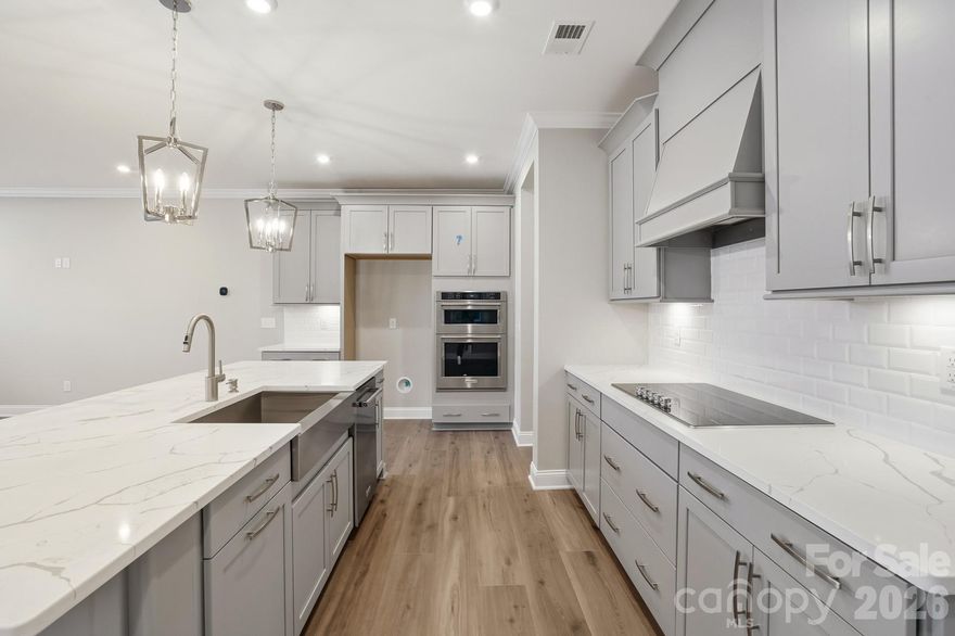 Location, Location, Location!  Luxury Brick 3 story townhome in Ballantyne features a 2nd floor Primary Suite with sitting area and 2 walk in closets!  Bedroom 4 is the 2nd Primary Suite on the 3rd floor and features a sitting area, walk in closet and en-suite bath with dual vanities.  The kitchen is appointed with Grey 42" cabinets with soft close drawers/doors with pull out trays.  Kitchen Aid appliances, ss Farmhouse sink, gorgeous white quartz and ceramic backsplash.  The home is filled with light from an abundance of LED recessed lights and beautiful trimmed windows.  Luxury wide vinyl plank flooring, 8' doors, crown molding, and 2" faux wood blinds throughout the home are a few of the upgrades that enhance this home.

One of 28 townhomes in our boutique community.  
Townes at Wade Ardrey is surrounded by residential communities while having retail and dining options close by.  1.5 miles from Blakeney Shopping Center - 3.5 miles from The Bowl at Ballantyne and less than 5 miles from Waverly/Rea Farms

Ask for details on the lower interest rate incentive with closing costs included currently offered through our preferred lender!