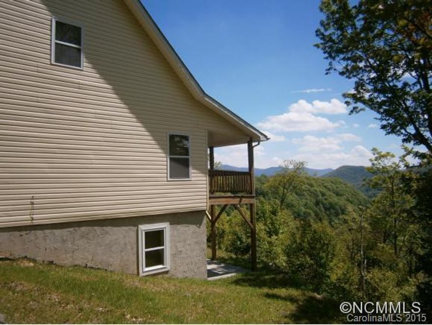 The sounds and sights of nature await you at this large and beautiful mountain home with 180 degree long-range mountain views! Greatroom has oak floors, stone FP and vaulted T&G ceiling. Roomy kitchen with an abundance of hickory cabinets. Covered deck off of MBR and living area. Light and bright in all living spaces, very private, with NO road noise. Wired for generator. Tastefully furnished and ready to go, would make great vacation rental!