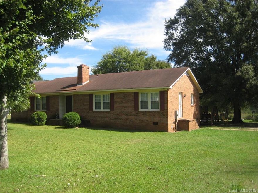 Spacious brick ranch, large family room with wood burning fireplace, 3 bedrooms, 2 full baths, newer windows, outside wired storage, wonderful country living.