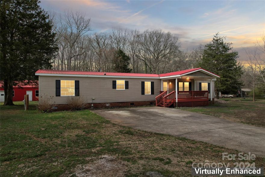 Experience the enchanting allure of this stunning residence situated on a spacious 1.9-acre lot. Step inside and be captured by the warm elegance radiating from the hardwood floors that adorn the main living areas. With freshly painted walls and a luxurious primary bathroom featuring a beautifully tiled walk-in shower and a sizable soaker tub, every detail has been carefully curated to provide the utmost comfort and style. Outside, discover the delight of raised garden beds and a delightful greenhouse, perfect for nurturing your green thumb. Additionally, a roomy garage/shop spanning 768 square feet offers ample space for all your storage and workshop needs. Embrace the tranquility of this property, free from any HOA restrictions, and relish in the peaceful ambiance it provides.