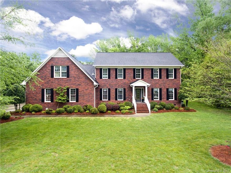 Imagine your own private suite inside your home.  Master suite on main, or a fully functional aging parents wing.  A spacious granite kitchen leading to a huge screen porch overlooking the private backyard.  This ALL brick 4 bedroom has a 3 car garage on a quiet cul d sac.