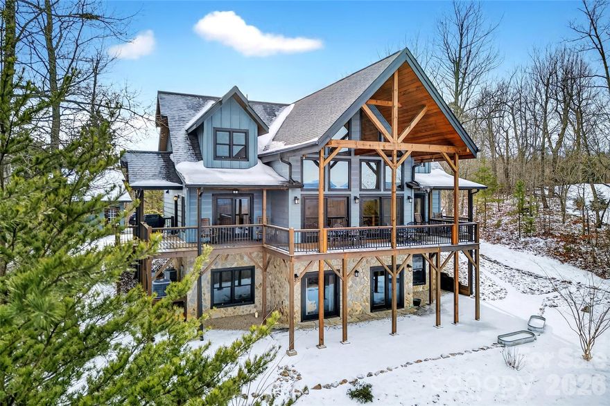 Perched high in the gated mountain community of Grandview Peaks, this exquisite 4-bedroom, 3.5-bath home offers some of the most breathtaking long-range views in Western North Carolina. From sunrise to sunset, enjoy sweeping vistas of Linville Gorge, Shortoff, Table Rock, Hawksbill, and the surrounding mountain ranges—with Sugar Top Resort visible in the distance on clear days.
The main level is thoughtfully designed for both everyday living and entertaining, featuring an open two-level great room anchored by a gas fireplace and expansive windows that perfectly frame the incredible scenery. A spacious open kitchen and dining area flow seamlessly into the living space, while covered front and back porches provide the perfect setting to relax and take in the mountain air year-round. The primary bedroom suite is conveniently located on the main level, along with a laundry room and half bath.
Upstairs, a cozy loft overlooks the great room and serves as an ideal reading nook or office space, accompanied by two bedrooms and a full bath.
The walk-out lower level offers exceptional flexibility, featuring a fourth bedroom, full bath, den or recreation room, bonus room, and abundant storage—perfect for guests, multigenerational living, or a private retreat.
A detached two-car garage adds both functionality and convenience, offering ample space for vehicles, storage, or outdoor gear.
Grandview Peaks is a premier gated mountain community known for its natural beauty and amenities, including walking trails, a community lake, recreation area, and a covered pavilion with fireplace and outdoor kitchen. Centrally located between Morganton, Marion, and Rutherfordton, this home delivers peaceful mountain living with easy access to surrounding towns.
This is a rare opportunity to own a refined mountain retreat where extraordinary views, privacy, and comfort come together seamlessly.