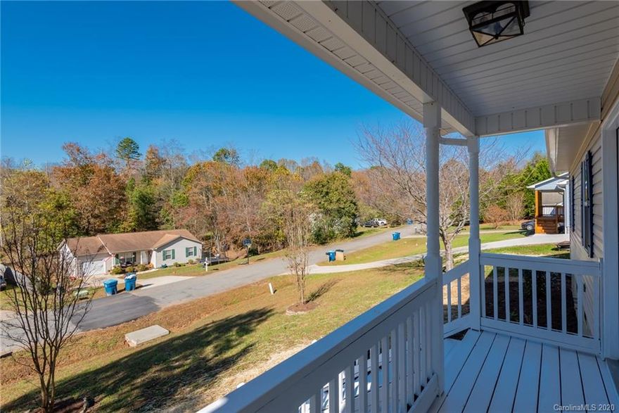 Enjoy sitting on your new front porch!  This 3 bedroom, 2 bath house is ready to move into and conveniently located between Hickory and Morganton.    All new paint, landscaping, bathroom lighting, mirrors and vanities, this home will make you proud.    Living room, kitchen and dining area all open and welcoming.  New back door opens onto a beautiful deck and a fun backyard.  New roof in October 2020!