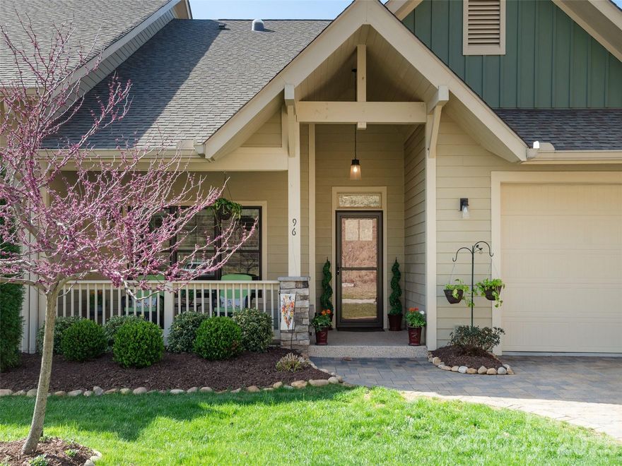 This gorgeous move-in-ready, lock-and-go home is located in Cummings Cove, one of the area's premier gated communities. Near Hendersonville and the Asheville Regional Airport. This meticulous one-level townhome offers 2 bedrooms, 2 baths, and year-round mountain views. High-end finishes & features include hardwood floors, custom built-ins w/ lighting & pull-out desk, plantation shutters & custom drapes, designer lighting, tiled kitchen backsplash, granite countertops, roll-out pantry shelves, & a wood-beamed vaulted ceiling in the great room. The spacious primary suite features dual vanities, a large shower, his-&-her walk-in closets, a guest bedroom and bath, a walk-in laundry/mud room, & SS appliances. Relax on the covered and screened porch off the great room, perfect for enjoying the mountain views. Furnishings available outside of the sale of the home. This exceptional property is a rare find-don't miss this opportunity