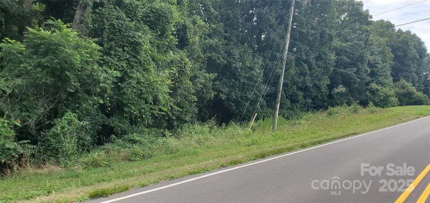 Wooded lot with Public water available in Davie County