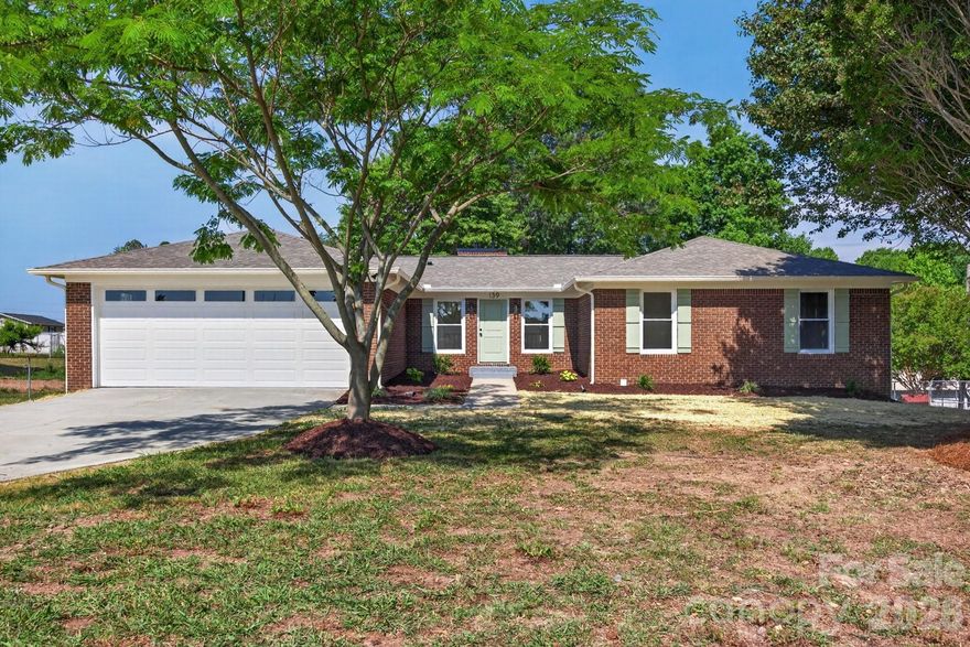 Beautifully renovated all-brick home situated on over half an acre, offering the perfect blend of classic charm and modern updates. This 3-bedroom, 2-bath home features new flooring, updated lighting, new HVAC, replacement windows, new roof, and stylishly updated bathrooms throughout. The completely remodeled kitchen showcases granite countertops, tile backsplash, and ample cabinet space. Enjoy both a spacious living room with fireplace and a separate dining room ideal for gatherings. The partially finished basement adds flexible living space with a second fireplace, while the large unfinished area with garage door provides endless possibilities for storage, workshop space, or future expansion. Outside, relax or entertain on the brand-new deck overlooking the expansive yard. Complete with a 2-car garage, this move-in-ready home has it all!