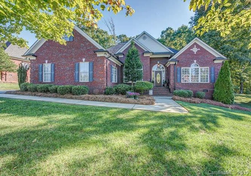 Lovely custom built Mediterranean design features hardwood floors, columns, carved moldings, open concept, scoring ceilings. Split plan has 4 bedrooms on the main. Large master suite w/double tray ceiling and cove lighting. Large patio overlooks the private back yard, professionally landscaped.