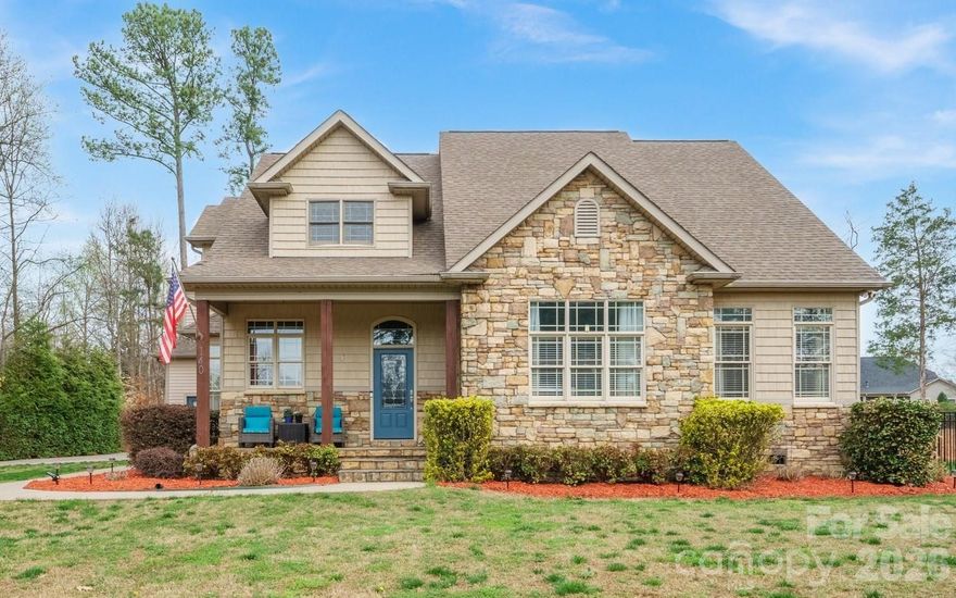 Priced 35k below current appraisal.  Motivated seller!  Dream no more—your perfect lake access home is here! No HOA! Vacation Rental friendly! Tucked away on a quiet street, this impressive 3,600+ sq ft home with a FOUR-car garage with 9 ft insulated garage doors captures the sought-after Lake Norman lifestyle, offering amazing outdoor living and easy lake access. The fully fenced backyard is a private escape, designed for both relaxation and family fun. Spend sunny days lounging in the sparkling saltwater pool, gentle on your skin, with a custom outdoor kitchen completing the ultimate backyard oasis. The spacious driveway has plenty of room for boat or RV parking, complete with a 220 RV hookup, making spontaneous lake trips effortless with the community boat ramp just minutes away. Inside, the home blends luxury, comfort, and practicality with soaring 10-foot ceilings, luxury vinyl plank floors, and sunlight streaming through large windows. The rare first-floor primary suite is a true retreat, featuring a spa-like ensuite with a custom walk-in shower, soaking tub, and walk-in closet. A handy drop zone off the garage keeps daily life organized. Private second living quarters with its own entrance includes a bedroom, office/bedroom, kitchen, dining, and generous living space—perfect for extended family, guests, or even a home office, gym, or media room. Ample storage, including floored attic space, adds to the functionality. There are two 50-gallon water heaters. Located near top-rated Woodland Heights schools and just 1 minute from the lake, this property offers the perfect mix of luxury, lifestyle, and location. With no HOA and vacation rental potential, the possibilities are endless!