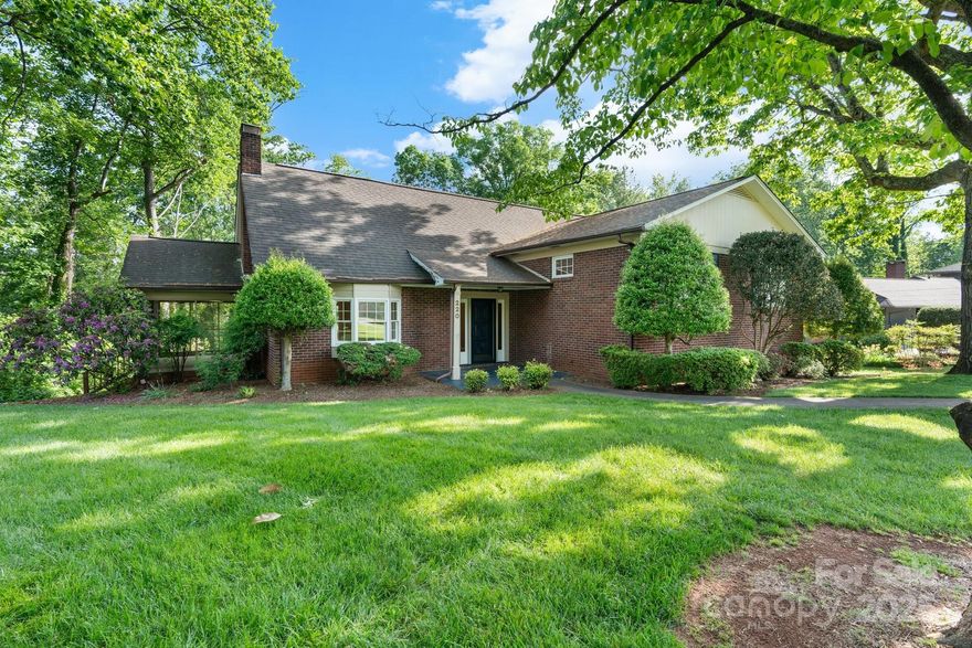 This warm & inviting home offers character & charm in downtown Morganton! Thoughtfully situated and set back on the 0.8 acre lot, the home boasts a large level front yard. Step inside to a spacious foyer. In the large living room, you'll find a charming bay window bathing the room in natural light and a fireplace. Off the living room is a screened porch. The main floor also includes a dining room and eat-in kitchen. Upstairs are two bedrooms and an updated hall bathroom plus a 3rd bedroom with en suite updated bath. The large primary suite occupies the entire top level of the home with built-ins and a large en suite bathroom with jetted tub. The basement has a large finished room with exterior entry perfect for an additional living space, office, or studio. Storage abounds in the unfinished basement area. Whether you're enjoying the large back deck or entertaining in the private backyard, this home offers a mix of classic craftsmanship and downtown living. A true Morganton gem!