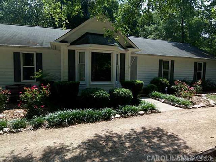 Gorgeously landscaped 4 bedroom, 3 bath ranch home is a charmer! With 2232 sq ft of living space, you will love the open floor plan. Hardwoods in most rooms and upgrades in kitchen. Huge bonus can serve as a a gym, playroom or guest bedroom! Vaulted ceilings & fireplace in the great room & ceiling fans throughout. Patio & deck on the tree filled fenced yard is great for entertaining!