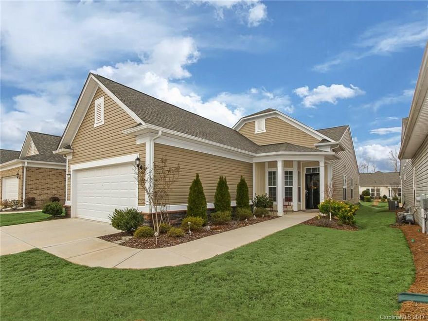 This cheery Pine Spring 2BR/2BA with office has a covered lanai, double sized patio and privacy fence.  It features an extended garage, tile floor and enhanced lighting. The interior has granite counters, tile backsplash, stainless steel appliances, gas stove, kitchen island with pendant lights, tile in the kitchen & foyer, ceramic tile in the baths and carpet elsewhere.  This home is move-in ready!  Come check out the community and the active adult lifestyle of Sun City Carolina Lakes.