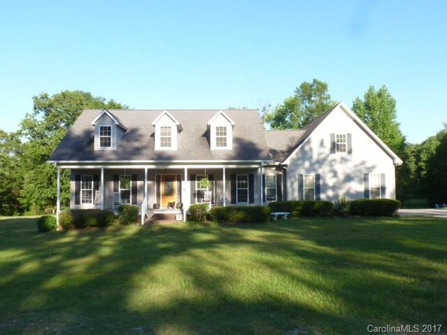 Country Living at it's best on this 26.45 acres with dbl stocked ponds. Enjoy the peace and quiet on your large back deck overlooking the ponds. Land fenced and cross fenced, large barn. Home has large country front porch, foyer, 5BR's, 3.5BA's, great room with fireplace/gas logs, great kitchen, appliances remain, huge bonus room above dbl garage, lots of storage, large master bedroom with walk-in closet, master bath has dbl vanities, garden tub and separate shower. County water, natural gas.