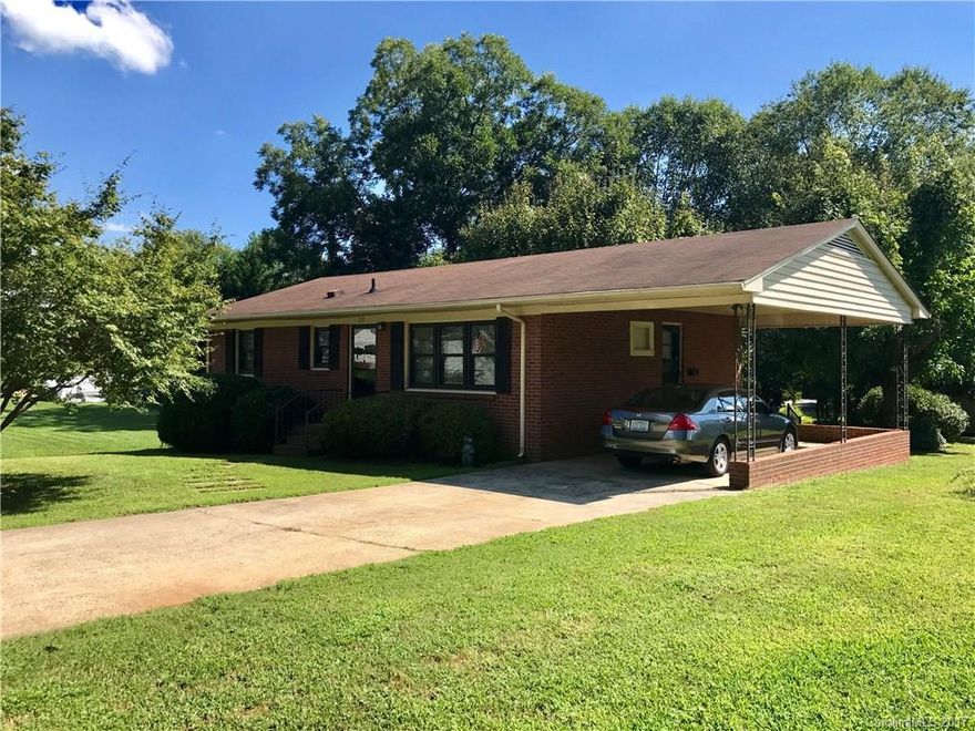 Nice All Brick Home with Carport, 2 Bedrooms and 1 Bath, spacious living room, kitchen with breakfast/dining area, walkin closet, hardwood floors under carpet, house has been very well maintained, all appliances to remain including washer and dryer, 24x24 workshop, outside steps to small unfinished basement area, nice lot $124,000