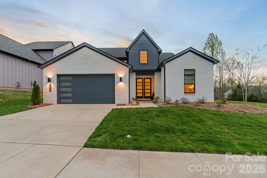 Better than new doesn’t even begin to cover it! Built in 2024 by Shea Homes, this award-winning Willow floor plan welcomes you with a striking 20-foot entry and designer lighting throughout, backed by over $200,000 in upgrades that completely redefine what you expect from new construction.

Positioned on a premium homesite in Amara Chase with no neighbors behind or to the right, the setting offers rare privacy with peaceful tree-lined views and a true sense of space.

Inside, every detail has been thoughtfully elevated. The kitchen is a true focal point, featuring high-end countertops, upgraded cabinetry, designer hardware, a granite sink, upgraded faucet, and enhanced pantry shelving. The open-concept layout flows seamlessly into the main living area, anchored by a gas fireplace and complemented by stunning hardwood flooring and curated lighting selections that carry throughout the home.

The primary suite delivers a spa-like retreat with a freestanding soaking tub, frameless glass shower, upgraded tile throughout, and a cohesive, high-end finish. Additional upgrades include an enhanced stair system, upgraded doors, custom interior paint, hard flooring in key upper-level areas, and a dedicated media room wired for surround sound. A flexible loft adds even more functional living space.

Designed for today’s lifestyle, the home also features a custom gym or office, offering versatility without sacrificing function.

Step outside and you’ll immediately understand what sets this property apart! Over $70,000 has been invested to create a private outdoor retreat, complete with dual patio extensions, built-in grilling stations including a flat top and traditional grill, a hot tub, upgraded landscaping, and a fully fenced yard - built for both entertaining and everyday enjoyment.

Recognized as a 2025 award winner for architectural design, the Willow plan is known for its flow and livability. Combined with a premium lot and extensive upgrades throughout, this home stands out as one of the most refined offerings in Amara Chase!

Located just minutes from Birkdale Village, downtown Davidson, and with easy access to I-77 and I-485, this home offers both convenience and a lifestyle that’s hard to match!