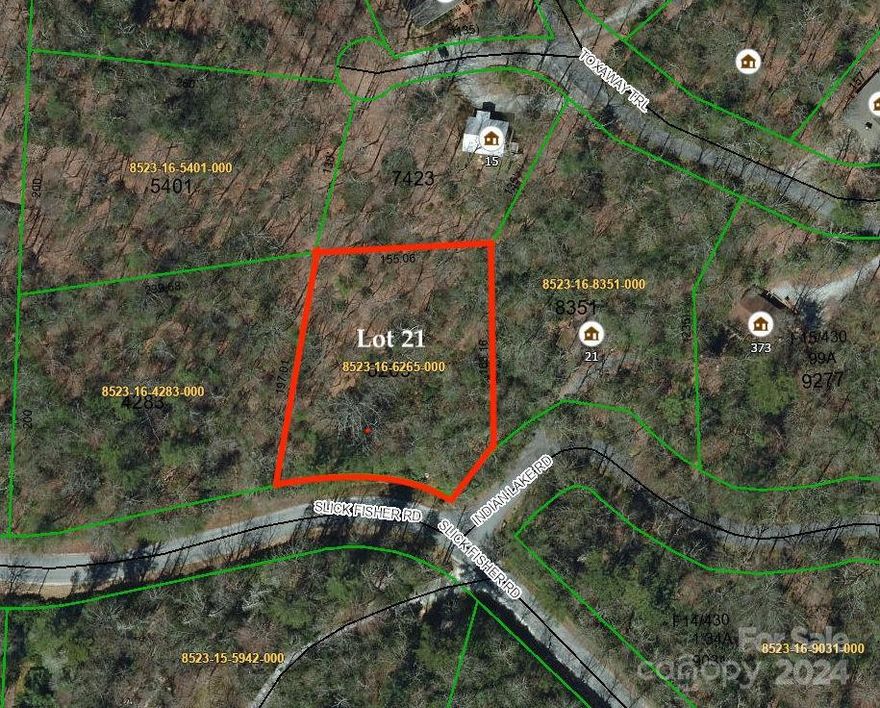 Corner lot in beautiful Indian Lake Estates in Lake Toxaway.  Discover this lovely lot in a private community with well-maintained roads, community lake and dock with launch site and community park. This unique lot sits at the front of the community for easy access with active septic permit on file.  Build your dream home in the mountains of Western North Carolina!