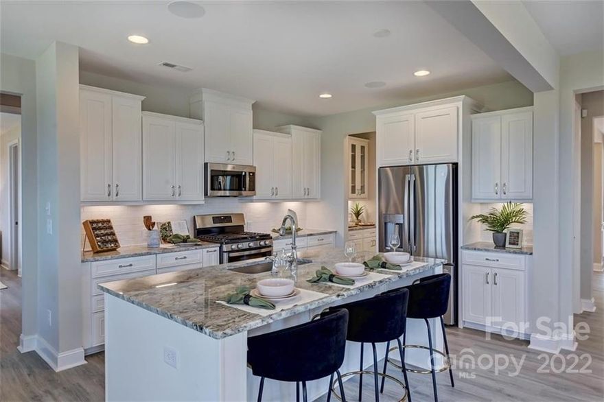 MLS#3863462 REPRESENTATIVE PHOTOS ADDED ~ Summer Completion! As you enter the Essex you will be greeted by a fabulous study and dining room. Continue into the heart of the home to the spacious kitchen with impressive cabinet space large island & walk in pantry. The casual dining area and spacious gathering room have a view of the backyard oasis and lead out to the covered porch. Main level bedroom suite is perfect for overnight guests. Upstairs there is a large game room, three bedrooms and three bathrooms. The owner's suite features a luxurious bathroom with separate vanities, garden tub and walk-in shower. Structural options added include: second suite, tray ceiling at owner's suite, 4' gathering room extension, fireplace, shower at first floor guest suite, rear covered outdoor living, laundry sink, study, additional windows at gathering room, and gourmet kitchen.