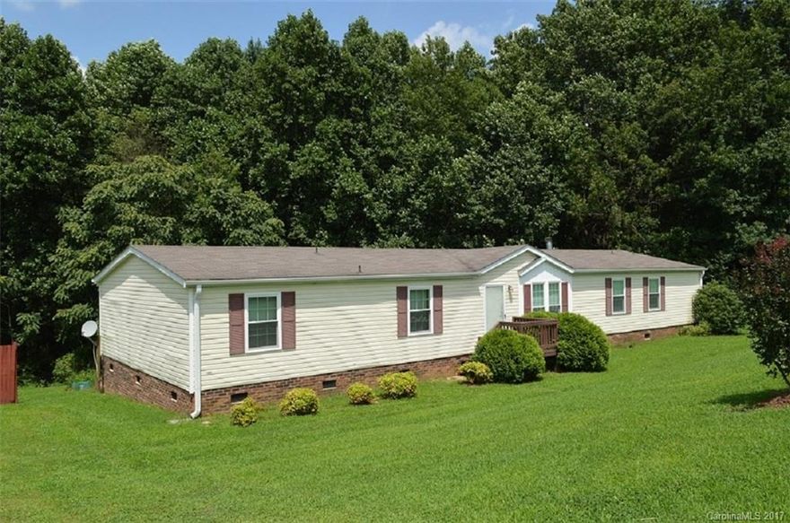 Beautiful 4BR, 3BA home on 2 acres. Hardwood looking laminate throughout living spaces. Large master bedroom and bath as well as split bedroom plan. Wood burning fireplace in den. Stainless appliances in the kitchen and large walk in pantry.  A run off stream runs through the wooded part of the property. Hard to find this much square footage on 2 acres for the money!