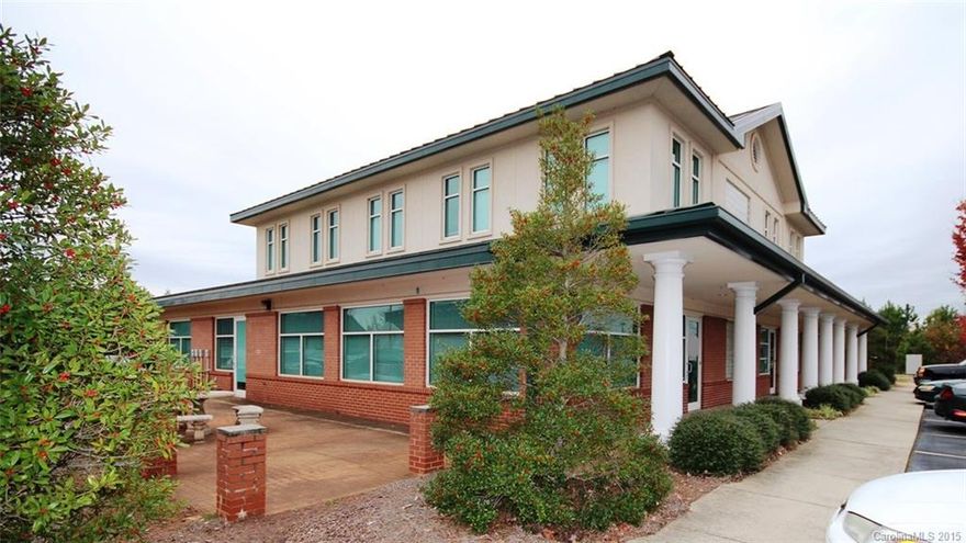 Great retail or office space with access doors on 3 sides, 2 restrooms, and large side patio