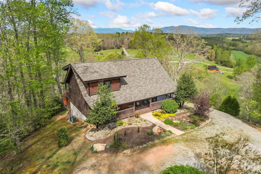 This exceptional property offers a tranquil, private setting on over two acres, complete with a wrap-around porch and breathtaking views of the Linville Gorge and Table Rock Mountain. The spacious home is designed for comfortable main-level living and ample entertaining areas. The upper-level loft mirrors the stunning views found throughout the house, while two additional bedrooms and a full bath create a welcoming space for guests. The full basement features flexible space, including potential for another bedroom and full bath, laundry facilities, a kitchen area with a second refrigerator and sink, plus a recreation or den area. Located in The Meadows at Lake James Station, this home is conveniently near Lake James, downtown Morganton, and Marion.
NEW ROOF 2025
Come see the beauty that awaits!!