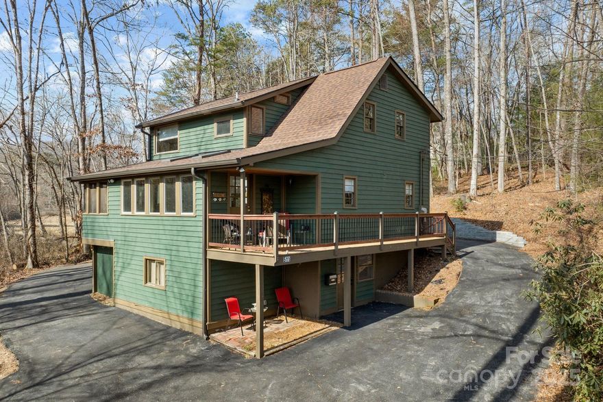Great opportunity in Mills River! Sitting on just under 2 wooded and private acres with a stream flowing through the property, this wonderful home is waiting for new owners! Cozy and with tons of character, it is move-in ready w/ a brand new roof installed in 2025! The main level has a spacious open kitchen & dining area with French doors leading into a lovely sun-room & screened in porch! Two bedrooms & a full bath complete the main level. Upstairs is devoted entirely to the primary suite oasis, with tongue & groove ceilings, a large walk-in closet, mini office nook & a gorgeous bathroom. The basement of this home was set up for a home office that offers several meeting or storage spaces. There is also plenty of room for a workshop or studio. Outside you'll find two good sized decks which are perfect for listening to the babbling stream. The completely wooded lot means no lawn to maintain!  A circular asphalt driveway completes this home! Minutes from Asheville Airport and breweries!