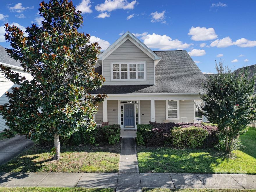 Welcome to this charming home with a spralling front porch located in the desirable Traditions neighborhood of Pineville. Enjoy quick access to I-485 and I-77, along with nearby schools, quaint, downtown restaurants, parks and athletic fields. This move-in ready residence features a spacious primary suite on the main level with luxurious bath and large closet. Functional kitchen with granite countertops, 42-inch cabinets, and a stylish backsplash. The inviting breakfast area flows into a two-story, great room, complete with a cozy fireplace. Upstairs, you’ll find three generous bedrooms and a versatile loft space. Don’t forget the finished bonus space above the two-car detached garage, ideal for a home office or recreational / flex space. Plus, you’ll appreciate the proximity to the new Pineville Police Department, library and Town Hall. A MUST SEE!