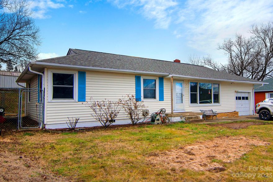 Welcome to 112 Trammell Ave, Canton! Are you looking for a solid built home in Haywood county? Close proximities to so much with an easy commute to Asheville, Waynesville, and surrounding areas. This home has a newer roof, freshly pressure washed siding, and new paint throughout the inside. Beautiful large sunroom with a wood fireplace that is great added living space. Everything is on one level, walk out to the back yard and find lots of potential to make it your own. Fence is new, and shed remains. Home is being sold "As Is".