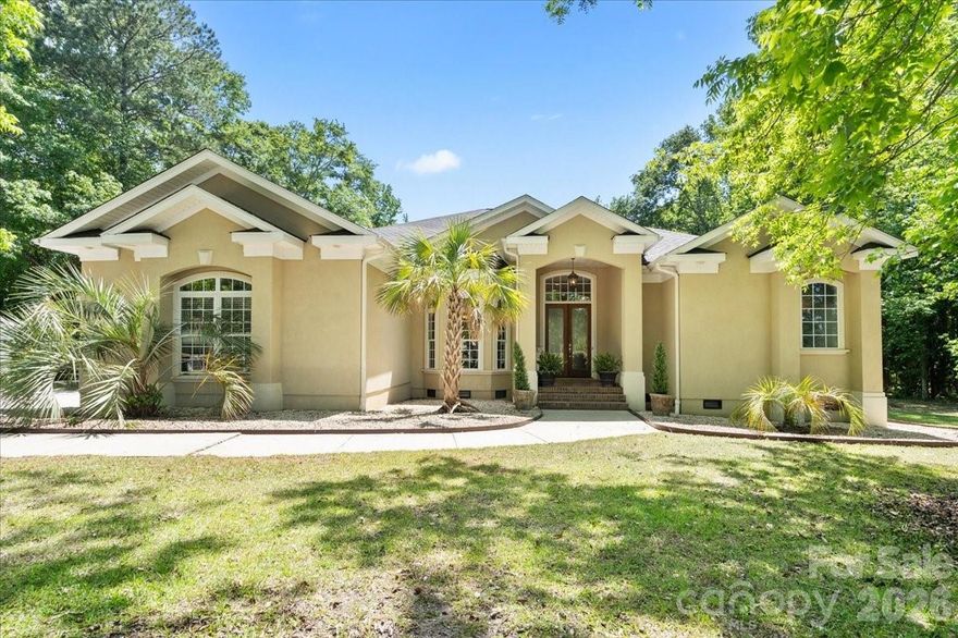 Tucked away on a beautifully wooded 1.38-acre lot in the charming town of Chesterfield, this stunning one-story stucco home offers the perfect blend of space, function, and timeless appeal.
Step inside to a dramatic two-story grand entry that sets the tone for elegant yet comfortable living. The formal dining area flows seamlessly into a spacious great room—ideal for entertaining, a piano space, or a cozy conversation lounge.
Designed for flexibility, this home features an oversized primary suite with private access to the covered back porch, creating a peaceful retreat. Three additional bedrooms provide plenty of room for family, guests, or your evolving lifestyle—one is currently used as a home office, making it a perfect flex space for work, play, or hobbies.
Outdoors, the property truly shines. Enjoy warm Carolina days by the in-ground pool with an impressive 9.5-foot depth, all surrounded by the privacy of mature trees. In addition to the attached two-car garage, you’ll appreciate the detached garage/storage building with electricity—ideal for projects, storage, or extra vehicles.
Whether you’re hosting gatherings, working from home, or simply enjoying the tranquility of small-town living, this home is designed to meet your needs at every stage of life.
Agent is related to seller
