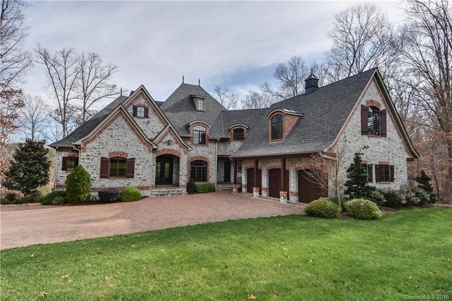 Magnificent 3 story home. Breath taking upscale finishes throughout, lg water views starting at the front door with 2 story windows overlooking the lake, Elegant outdoor screened porch, stone patio and covered patio, Lg gourmet kitchen, dining rm features wood coffered ceiling. Lg owners suite w/dome ceiling & amazing bath suite. Lake level has a wine cellar, billiards, theater room, guest suite.  Private Flat Lot. Close to waterfront dining, Charlotte, Mooresville, Shopping & Restaurants.