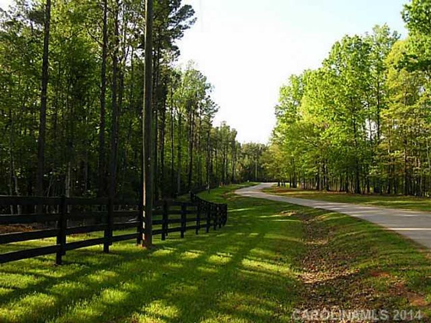 Beautiful tract of land located in the Lawson Farms community. This tract has it all! A nice topo w/several build-sites, beautiful mature hardwoods for shade & privacy, & a running creek to attract an abundance of wild-life. The street is lined w/4-board black fence & large hardwoods, & the community has light restrictions to maintain the look & feel of like-in-kind country properties. NO HOA FEES