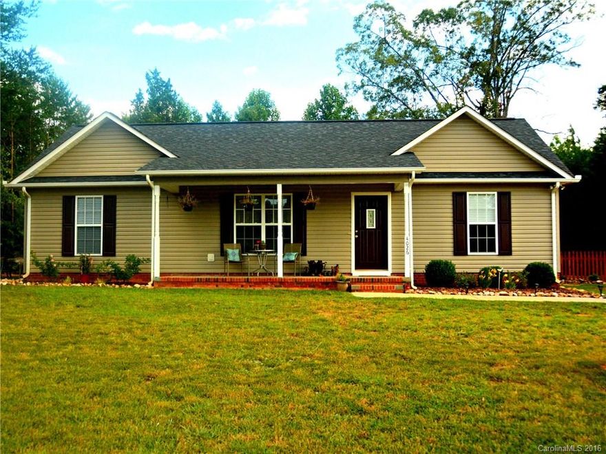 100% USDA financing available on this beautiful home situated on over an acre lot! Spend your evenings on your rocking chair front porch! This home features a 3 bedroom 2 bath open floor plan with warm colors throughout, a large family room and an eat-in kitchen. Large flat back yard with a wired workshop.  All stainless steel kitchen appliances and window treatments will convey with the sale!