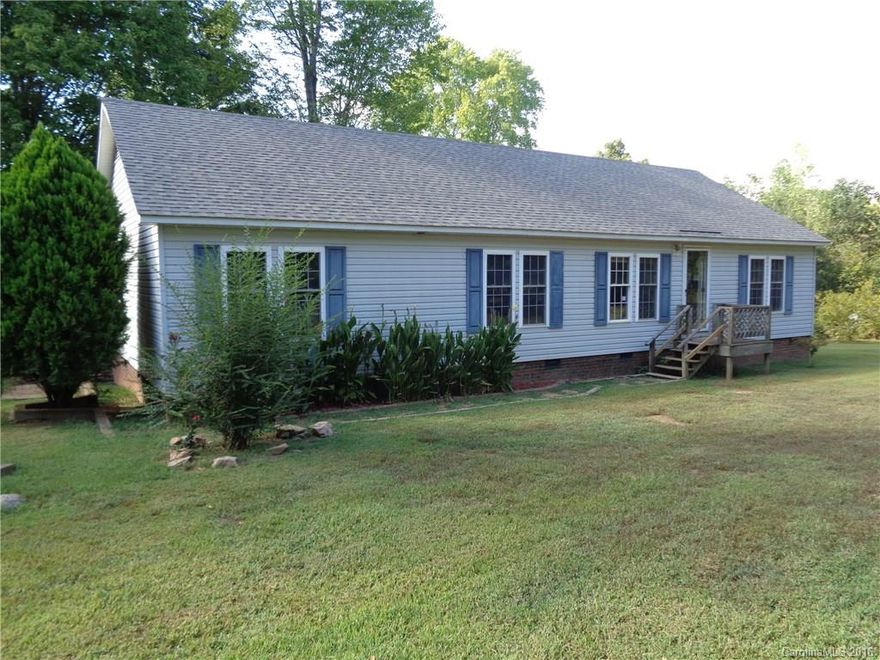 Off the main road in very private location with acreage. Three bedrooms and two full baths with fireplace. Large yard with deck. TAX records say house is a modular. Needs a new hot water heater & other plumbing repairs