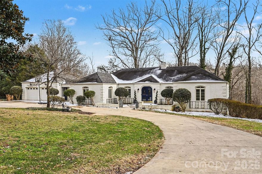 This charming 4 bedroom/3 bath French Provincial-style home sits proudly on coveted Peach Street and blends timeless character with stylish modern updates. The gorgeous oversized kitchen features stainless steel appliances, granite countertops, a custom backsplash, and a cozy built-in banquette-perfect for everyday living and entertaining. Baths have recently been updated with new flooring, beadboard and paint. Great flow & natural light fill the main level, with spacious living room, dining room, & sunroom stretched across the entire back of the house. Architectural details shine, including arched casement windows, hardwood floors, custom arched double doors, beautiful molding, and a marble-surround fireplace. The primary bedroom and bathroom are conveniently located on the main level along with two additional bedrooms and bathroom. Downstairs, enjoy a spacious family room with a brick hearth fireplace and built-in bookshelves, plus a bedroom, full bath, and large laundry room. There is nearly 1000 sf of unfinished storage space that could easily be finished to provide more living area...the sellers have a great home gym in this space! An oversized two-car garage and circular drive complete this exceptional property. Other updates: new kitchen disposal, new flooring in laundry room, basement family room foundation wall has been moisture-locked and new paneling installed.  Sellers are offering a one year home warranty for buyers' peace of mind! This is a MUST see!