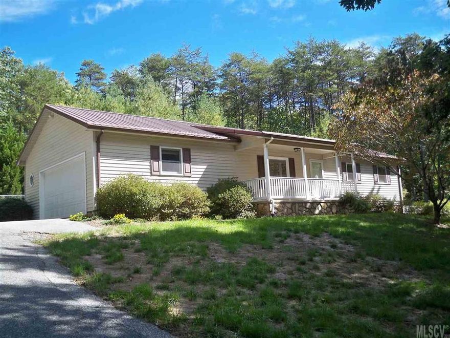 Immaculate home located on a rural dead end road, with other well kept homes. Beautiful country setting surrounded by woods, semi private. This home features hardwood/tile floors, a fireplace, a sunroom, fenced in back yard, RV carport, double garage on the main level, single garage in the basement, new dual zone heat pump and well insulated. This home has been well kept, clean and move in ready. Sits on 1.42 acres, no city limits. 7 miles from Google in Lenoir.