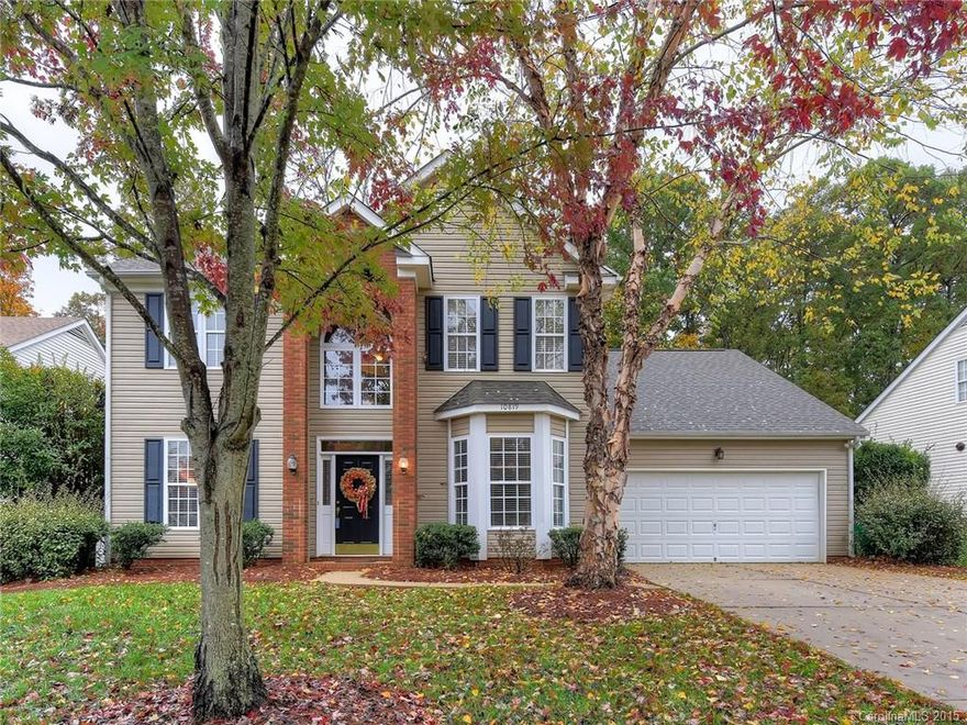 Fabulous Ballantyne home won’t last long! Great curb appeal on Cul-de-sac street. 2-story foyer opens to Formals w/rich moldings. Gorgeous scraped wood floors thru-out main level. Open concept Family Rm w/gas log FP w/marble surround. Kitchen has granite counters, 42 in. cabinets & breakfast area w/bay window overlooking private patio & landscaped yard. MBR has double doors, vaulted ceiling & private BA w/dual sinks & separate tub & shower. Large secondary BRs + bonus w/vaulted ceiling.