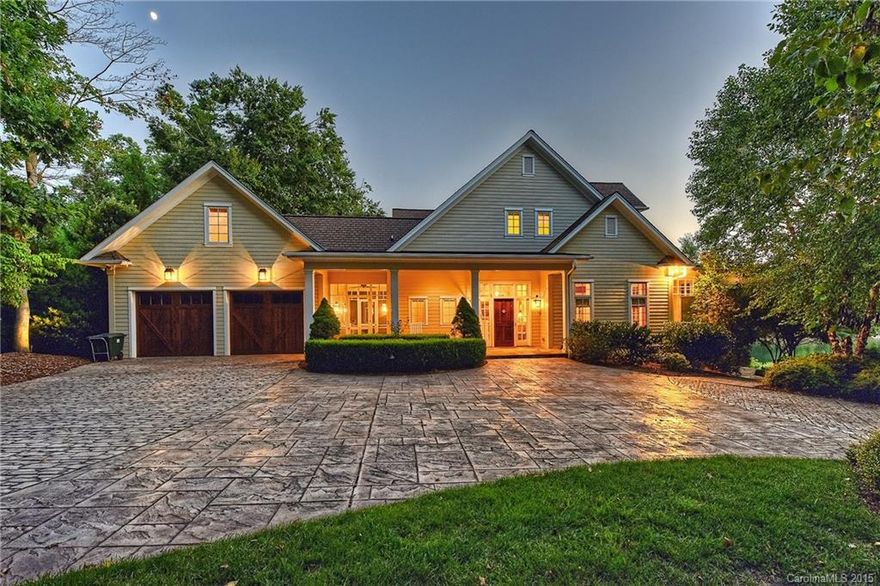 Highly desirable coastal style home exudes casual elegance. Enjoy relaxing Lake Norman views and breezes from the signature screened porch running the length of the main floor. Gourmet kitchen, tasteful interior decor, rich pine floors, wine cellar, large owners' retreat with private gym, all combine to create a sense of lake front intimacy in a classic cottage style custom home. The outdoor spaces are highlighted by a pergola and terraced dining area with stone hearth. Furnishings available.