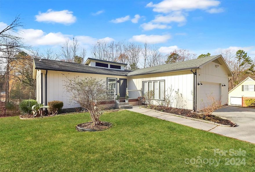 This stunning 4-bedroom home is situated on nearly an acre of private land, offering a serene and peaceful setting. The property features two outbuildings, a tranquil koi pond, and a spacious deck that’s perfect for entertaining or simply relaxing while enjoying the picturesque wooded views. Inside, the home has been beautifully updated with LVP floors, fresh paint, and modern finishes, including quartz countertops ,new light fixtures and carpets less than 7 months old. The updated primary suite boasts a new shower, tub, and faucets. The expansive family room includes a lovely electric fireplace, large windows overlooking the fabulous back yard.  The lower level includes 3 generously sized bedrooms, a full bath, and a half bath. Don't miss the bright and open sunroom, a perfect space that can be utilized as a flex room for your needs. This home offers the ideal combination of modern upgrades and peaceful outdoor living.