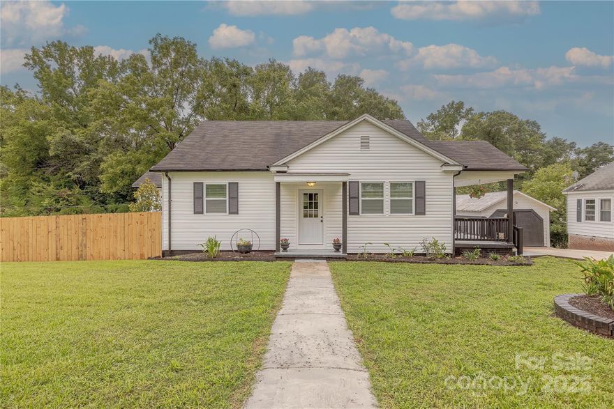 Welcome to this charming, fully renovated 3 bedroom & 2 bath home, perfectly blending modern updates with cozy inviting spaces. Situated on nearly half an acre with a wooded backyard, this home offers both privacy & convenience. It's a true move-in ready gem! Featuring an open concept layout that’s perfect for entertaining with lots of natural light. Interior updates- freshly painted, new vinyl plank flooring, updated kitchen with new cabinets, new countertops, new stainless steel appliances including refrigerator, stove, microwave, & dishwasher. New plumbing, new electric wiring, new recessed lighting, new ceiling fans, & new blinds. Exterior-new vinyl siding, new windows, new landscaping & new wood fence. Relax & entertain on the new deck added to the covered porch, perfect for outdoor living. This home is a true standout, with every detail thoughtfully renovated to make it the ideal space for you and your family. Don’t miss out—schedule your tour today!