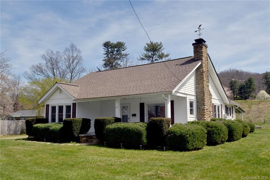 Character awaits you at this charming farmhouse style home located on a quiet street close to town. 3/2 plus office/den. Covered porches both front and back; hardwood floors, updated bathrooms and kitchen.  Kitchen has custom cabinets, solid surface countertops and tile backsplash. Gas logs in stone fireplace in living room. Central heat-oil furnace. Updated windows, new roof. Partially fenced with plenty of garden space, several out buildings, includes extra lot to the right pin: 8604-97-3393