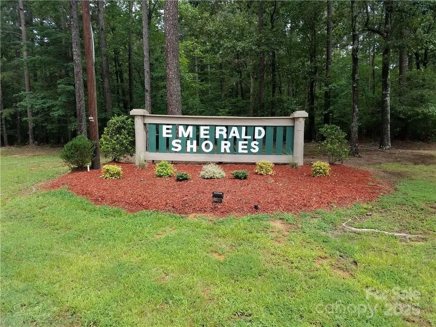 Beautiful Waterfront Lot in Emerald Shores on Lake Tillery.  

Buyers should apply for a pier permit with Duke Energy to confirm the ability to build a boat house as part of their due diligence.