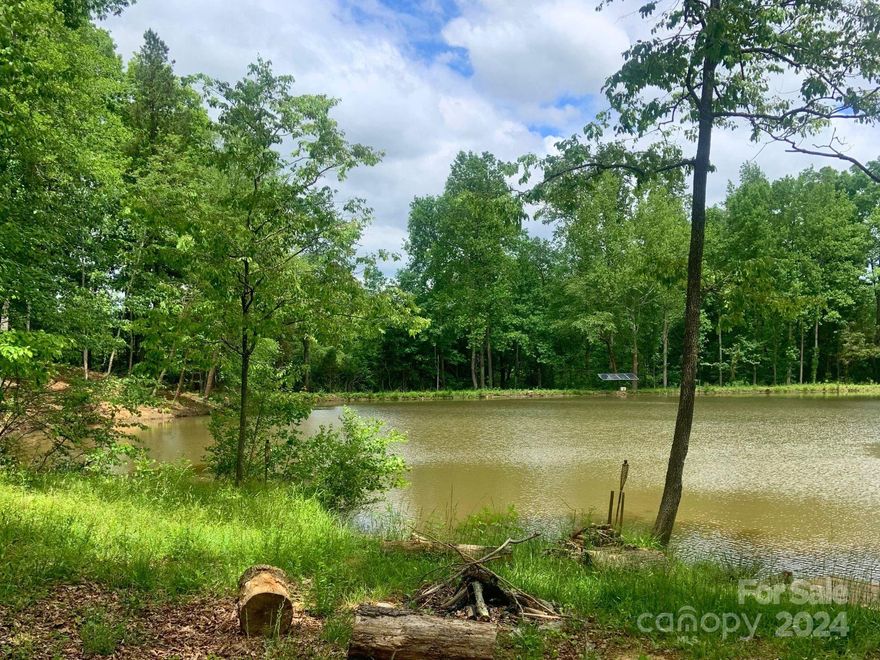 Incredible opportunity to build your DREAM home just 2 miles from downtown Davidson with low Iredell County taxes in brand-new custom home community, Davidson Pond! Spacious, pond-backed homesite with quick access to fabulous boutiques, gourmet restaurants, Village Green Park, and a great location for your luxury custom home to be built by repeat "Best of the Lake" winners, AR Homes - Monterey Bay Charlotte. Choose from a wide variety of fully customizable plans, including ranch and 2-story options, or partner with experienced local teams to design and build your one-of-a-kind AR Home, complete with high-end finishes throughout. Call to schedule your personalized design consultation today.