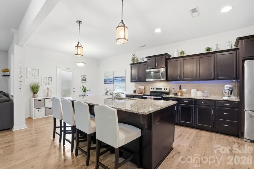 Nestled in the charming community, this beautiful residence offers a peaceful retreat while keeping you close to modern amenities. This property is an exceptional opportunity for those seeking a move-in-ready home in a desirable neighborhood.

Step inside to find a thoughtfully designed layout that maximizes space and natural light. The home welcomes you with an open and airy atmosphere, perfect for both relaxing evenings and entertaining guests.
Spacious Living Areas: The main living space serves as the heart of the home, offering a warm environment with durable flooring and neutral tones ready for your personal touch.
Modern Kitchen: The well-appointed kitchen features ample cabinetry, generous counter space, and a kitchen island, making meal preparation a delight. Whether you are hosting a dinner party or enjoying a quick breakfast, this space delivers functionality and style.
The bedrooms are sized generously to ensure comfort for everyone in the household. The primary suite offers a private sanctuary with an ensuite bath and walk-in closet, providing the perfect place to unwind after a long day.

** Backyard Oasis:** Step out back to enjoy your own slice of nature. The yard offers room for gardening, outdoor play, or summer barbecues. It’s a versatile space ready to adapt to your lifestyle needs.
Garage & Storage: The property includes a garage for parking and additional storage solutions for tools and recreational gear.

Verify schools with Stanly County Schools.