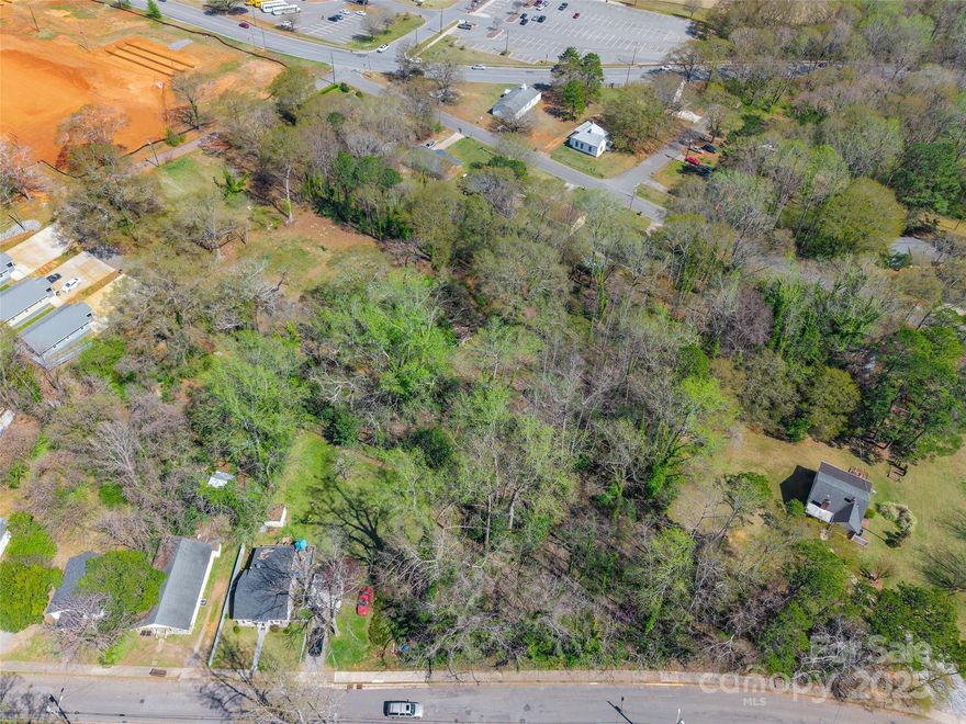 This parcel is approximately 1/2 acre, with an additional .2462-acre parcel (Parcel #20734) being sold separately. The properties connect, offering potential for a larger combined space. Zoned R6, buyers are encouraged to verify zoning for their intended use. Conveniently located near South Washington Street in Shelby, this property provides easy access to Uptown Shelby, local restaurants, schools, and recreational amenities such as the Cleveland Country Club and Shelby City Park.