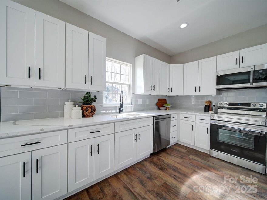 Beautifully renovated 4 bedrooms 2.5 bathrooms home in the charlotte area. Enjoy a quick access to major highways, Uptown Charlotte, and Lake Norman! Spectacular modern updates. Gorgeous kitchen with custom, soft closing cabinets, subway gray tile, quartz countertops, high-end SS appliances. New laminate flooring, light fixtures, tiles, vanities, shower door, furnace and garage door. Master bedroom has a private bathroom and a huge closet with plenty of room. Huge garage and a new deck in your private backyard.  Enjoy community amenities, including a pool and a playground. Must see!!